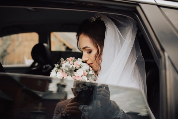 photography of the bride in the car